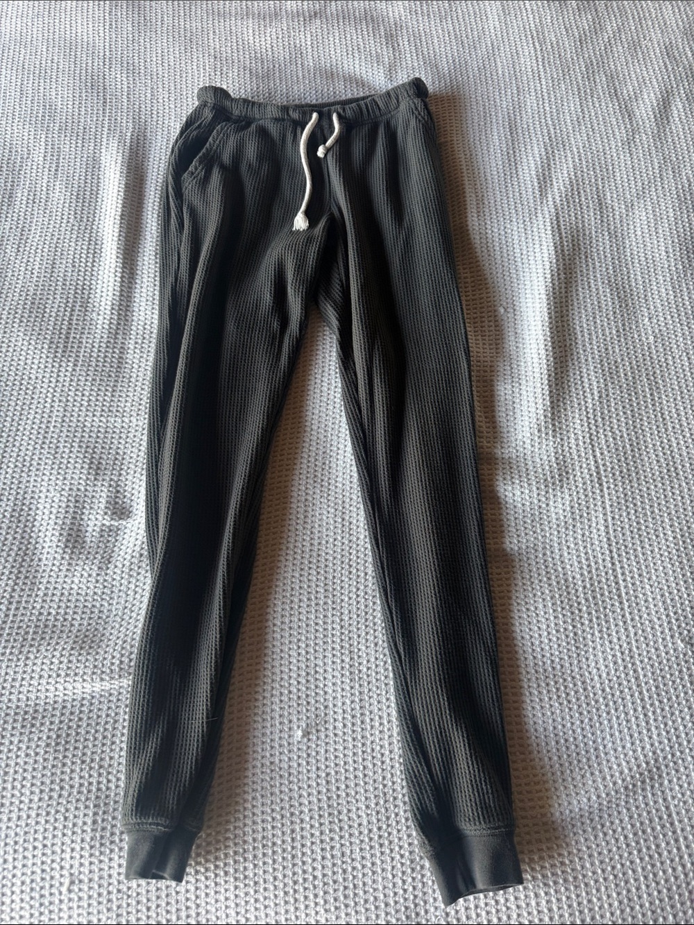 Women’s waffle knit Drawstring Jogger Pants. Color is a dark gray